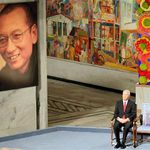 Nobel Commitee chairman Thorbjorn Jagland sits next to an empty chair with the Nobel Peace Prize medal and diploma  during a ceremony honoring Nobel Peace Prize laureate Liu Xiaobo.